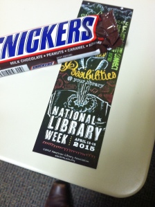 Snickers bar and a National Library Week 2015 bookmark